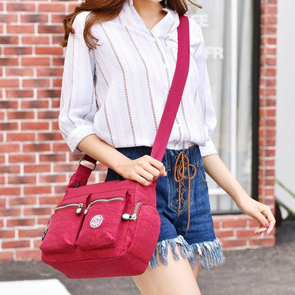 Woman Wearing Red Handbag With Satchel Strap 